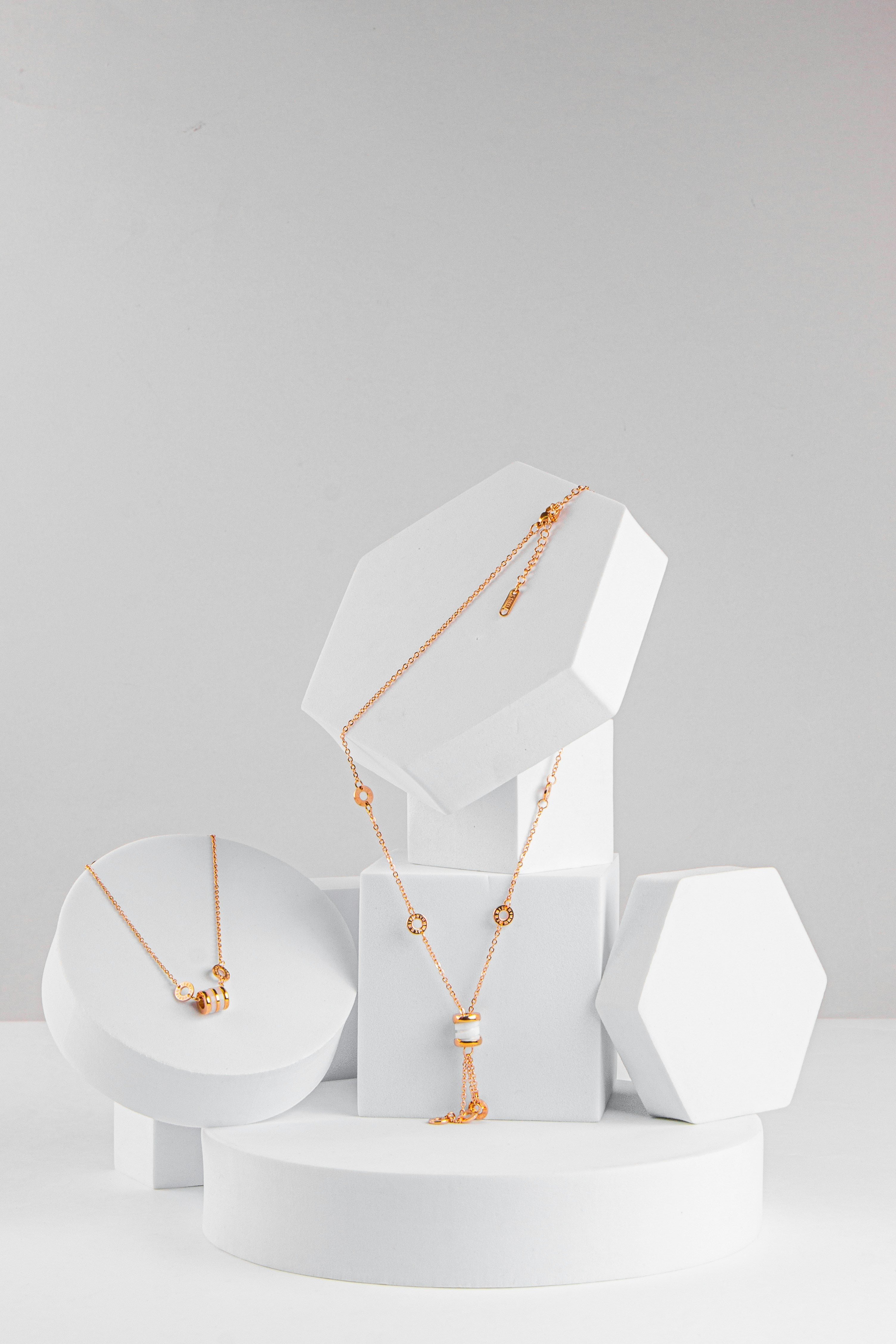 1. Women's ivory leather bracelet with brass fastener by Tairi Roosve, shown on wrist in lifestyle setting