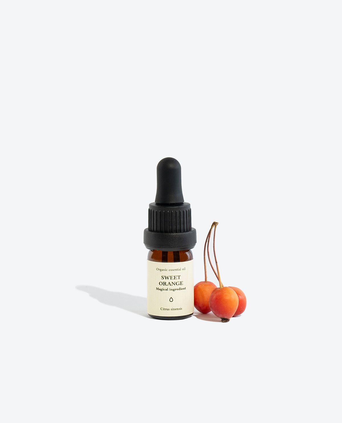 1. Smells Like Spells TANGERINE Essential Oil with box, featuring 5 ml glass bottle and pipette, studio setting