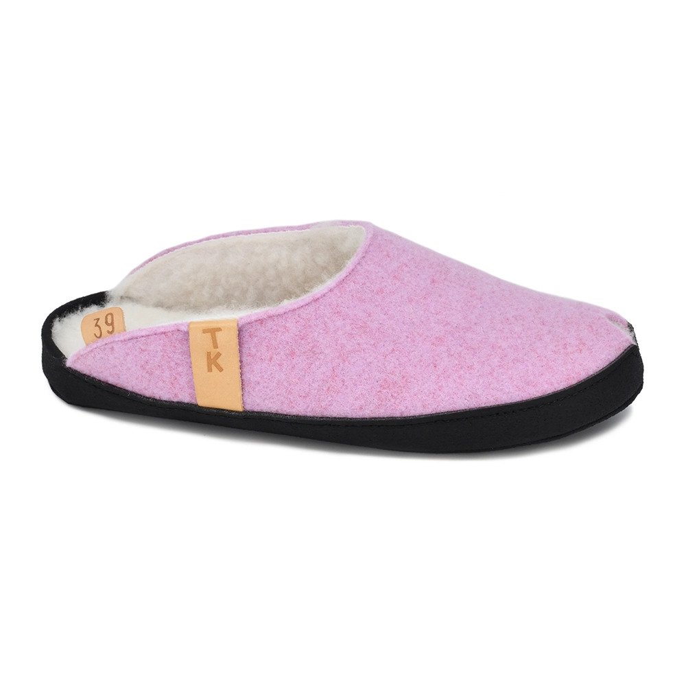 1. Unisex TOKU Bern white slippers by Omaking worn by a model in a lifestyle setting, showcasing comfort and style