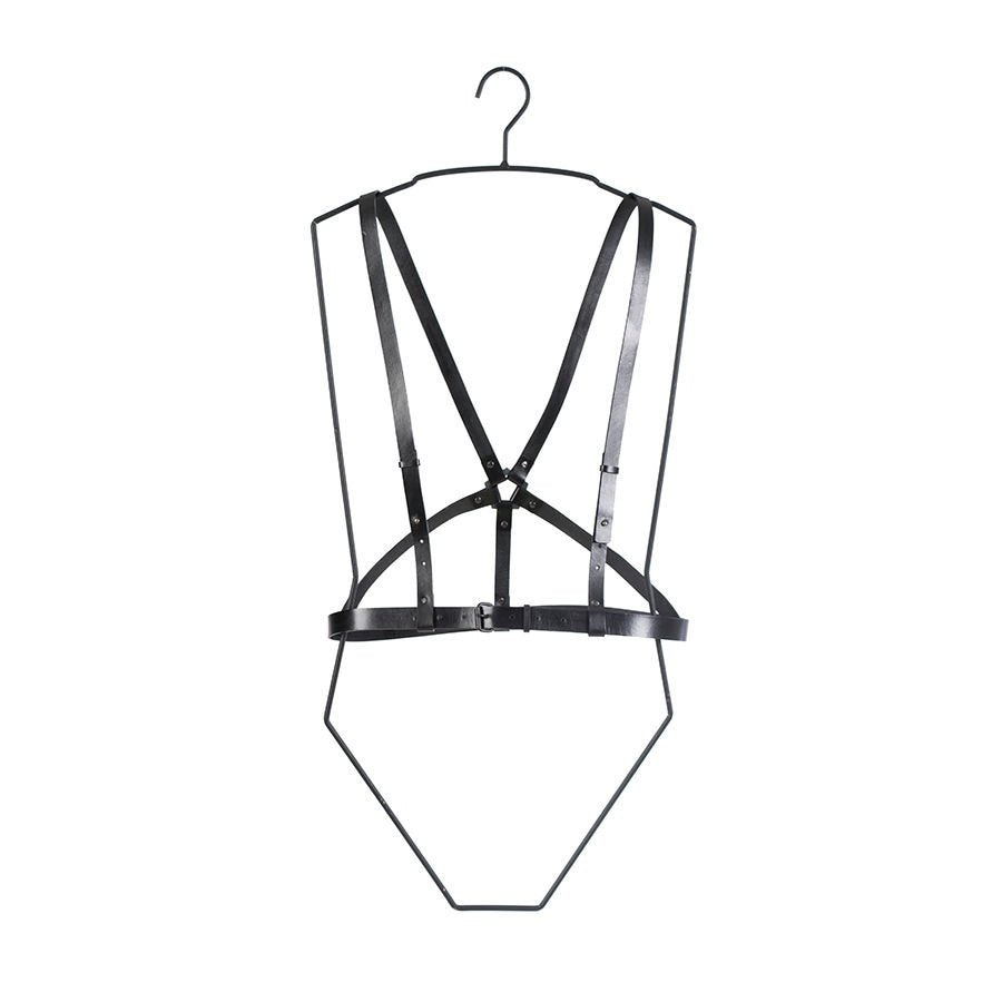 1. Women's black leather body harness by RR worn over a yellow floral dress, showcasing versatile styling