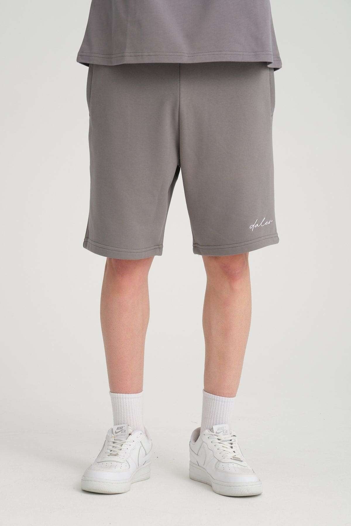 1. Unisex black Panda Soft Fleece Sweatpants by Sossu worn by male model in studio setting