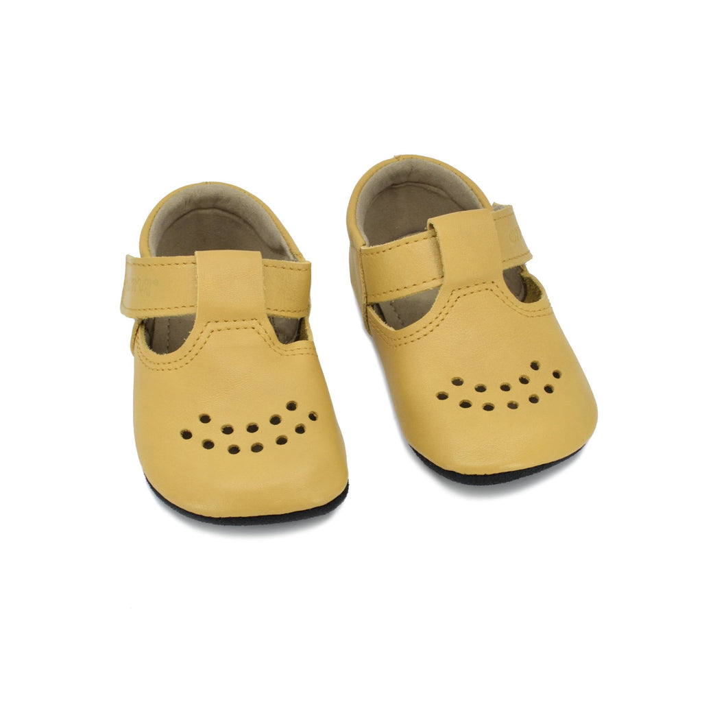 4. Studio image of Omaking yellow Mutsu slippers, featuring extra soft leather and anti-slip sole