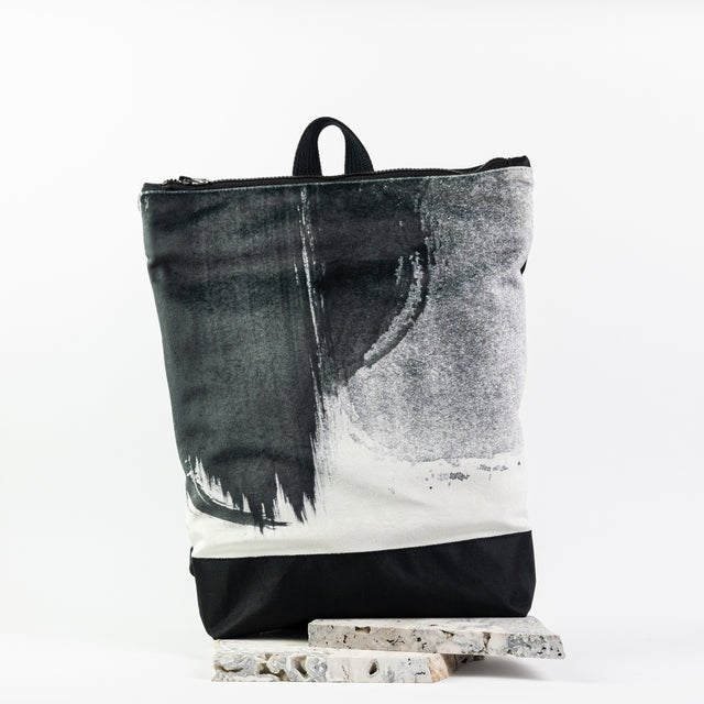 8. Muni Black Watercolor backpack in studio with marble accents