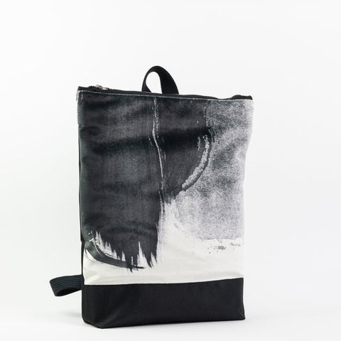 5. Muni Black Watercolor backpack with flowers, showing artistic design
