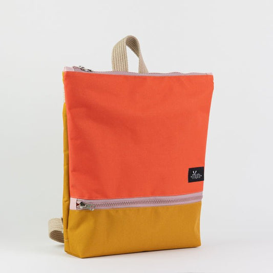 1. Muni waterproof kids backpack in orange and yellow, studio shot showing front design and zipper closure