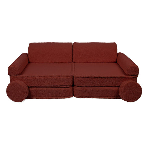 1. Large brown modular children's sofa with two back cushions and circular side pillows, shown in a studio setting