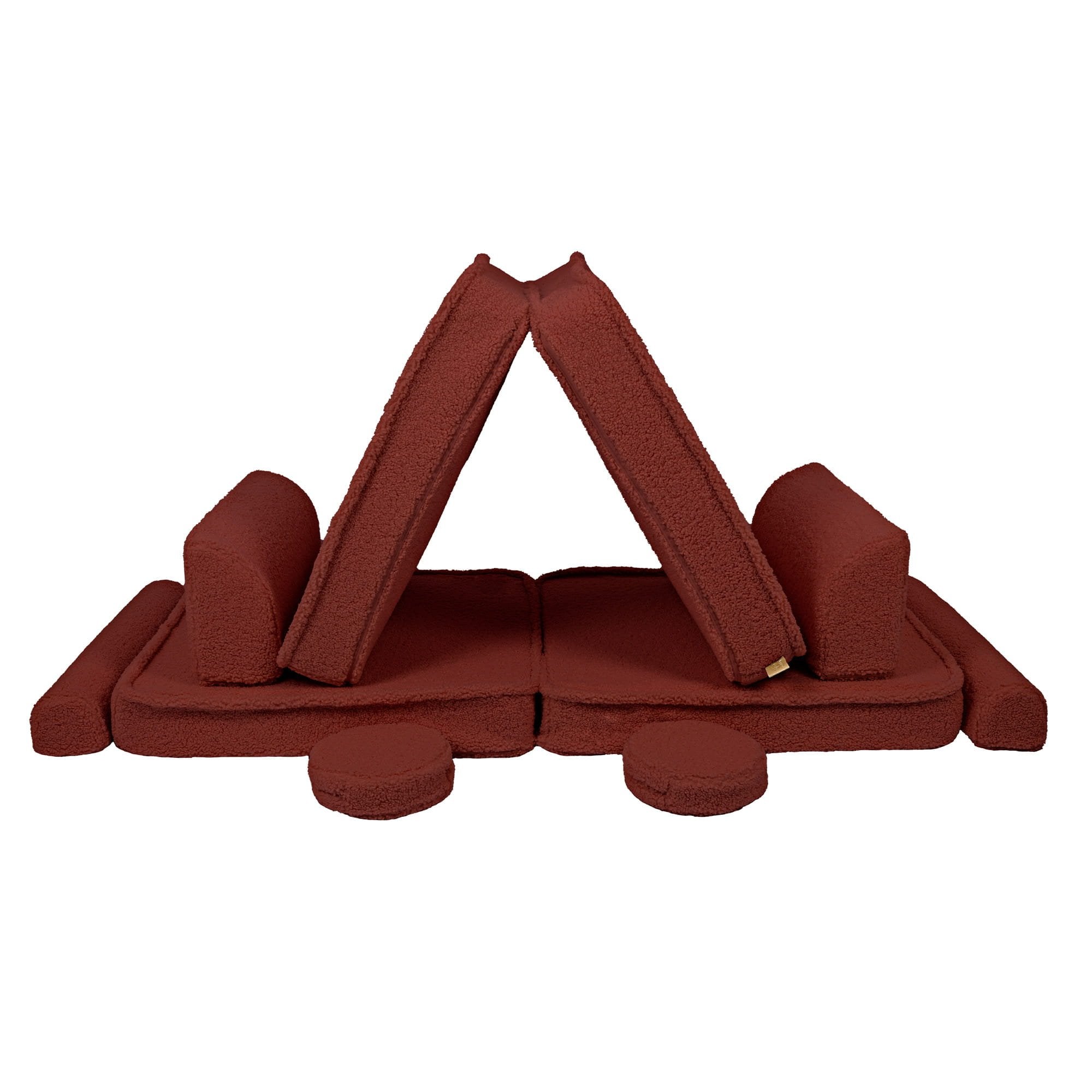 2. Brown modular sofa pieces arranged in a tent-like structure, showcasing versatility and creativity