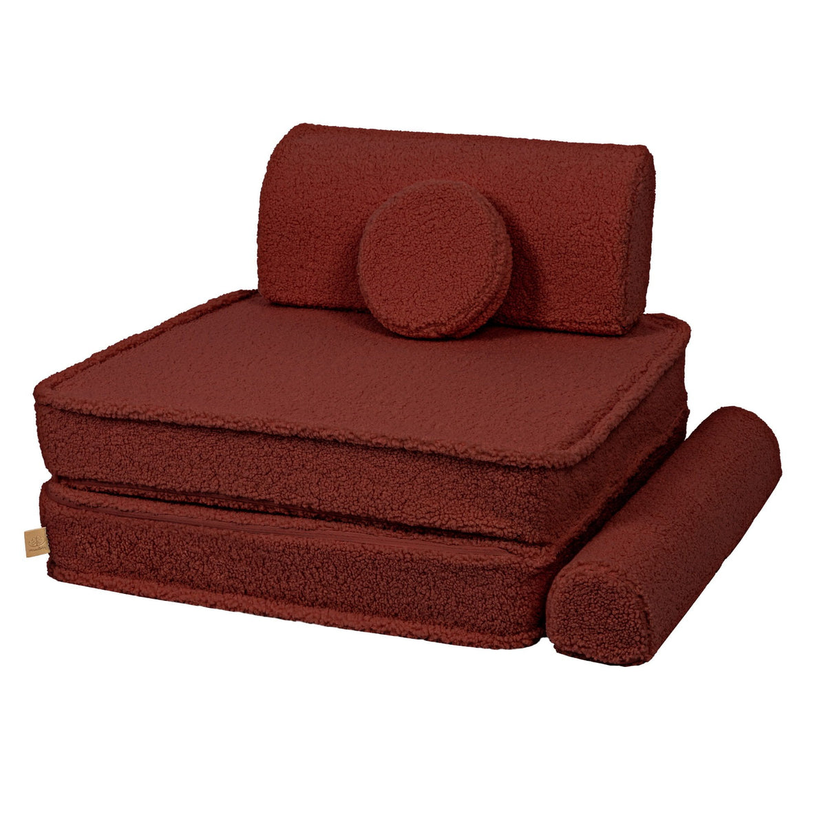 4. Brown modular sofa configured as a single seat with a backrest and circular pillow, demonstrating flexibility