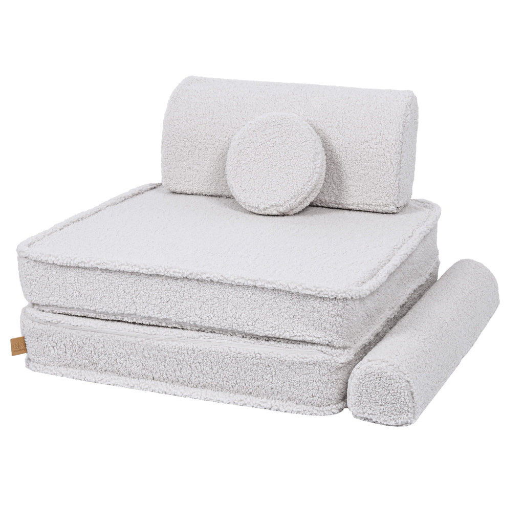 2. Large modular children's sofa in bearly white with cushions stacked to form a chair