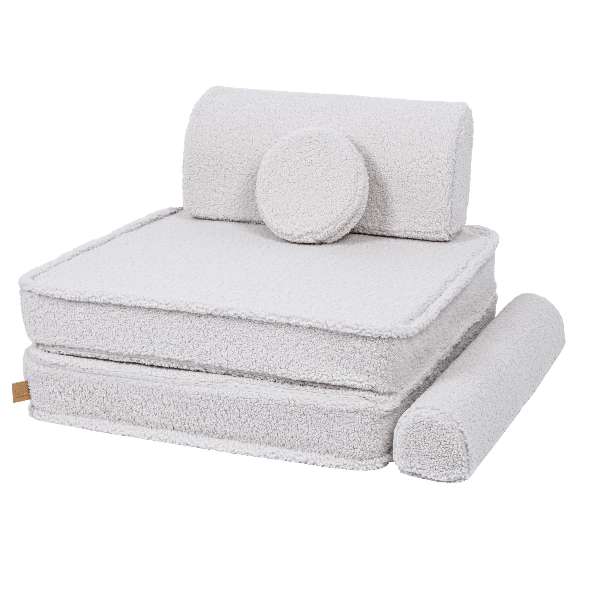 2. Large modular children's sofa in bearly white with cushions stacked to form a chair