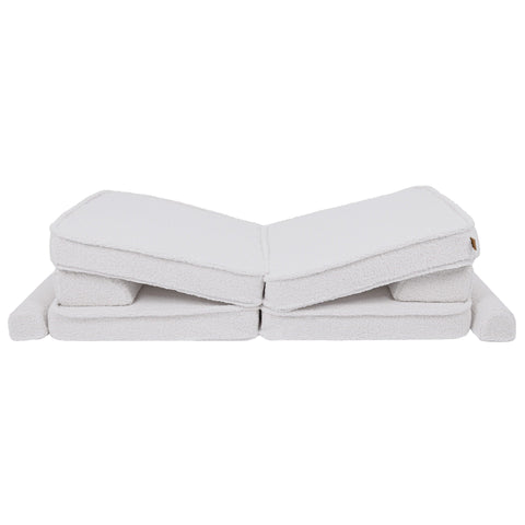 2. Large modular children's sofa in bearly white with cushions arranged in a reclined position
