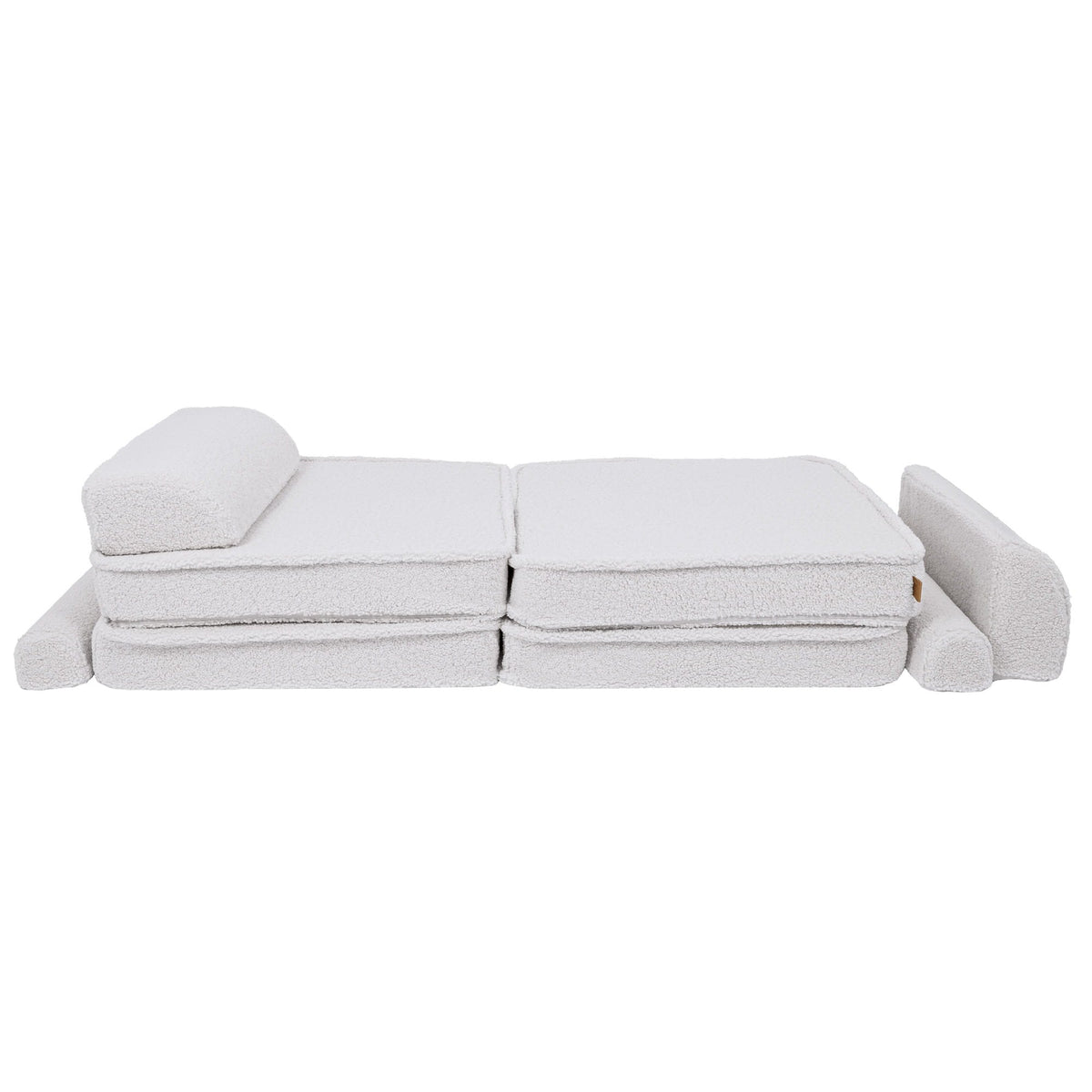2. Large modular children's sofa in bearly white shown in a flat position with cushions rearranged