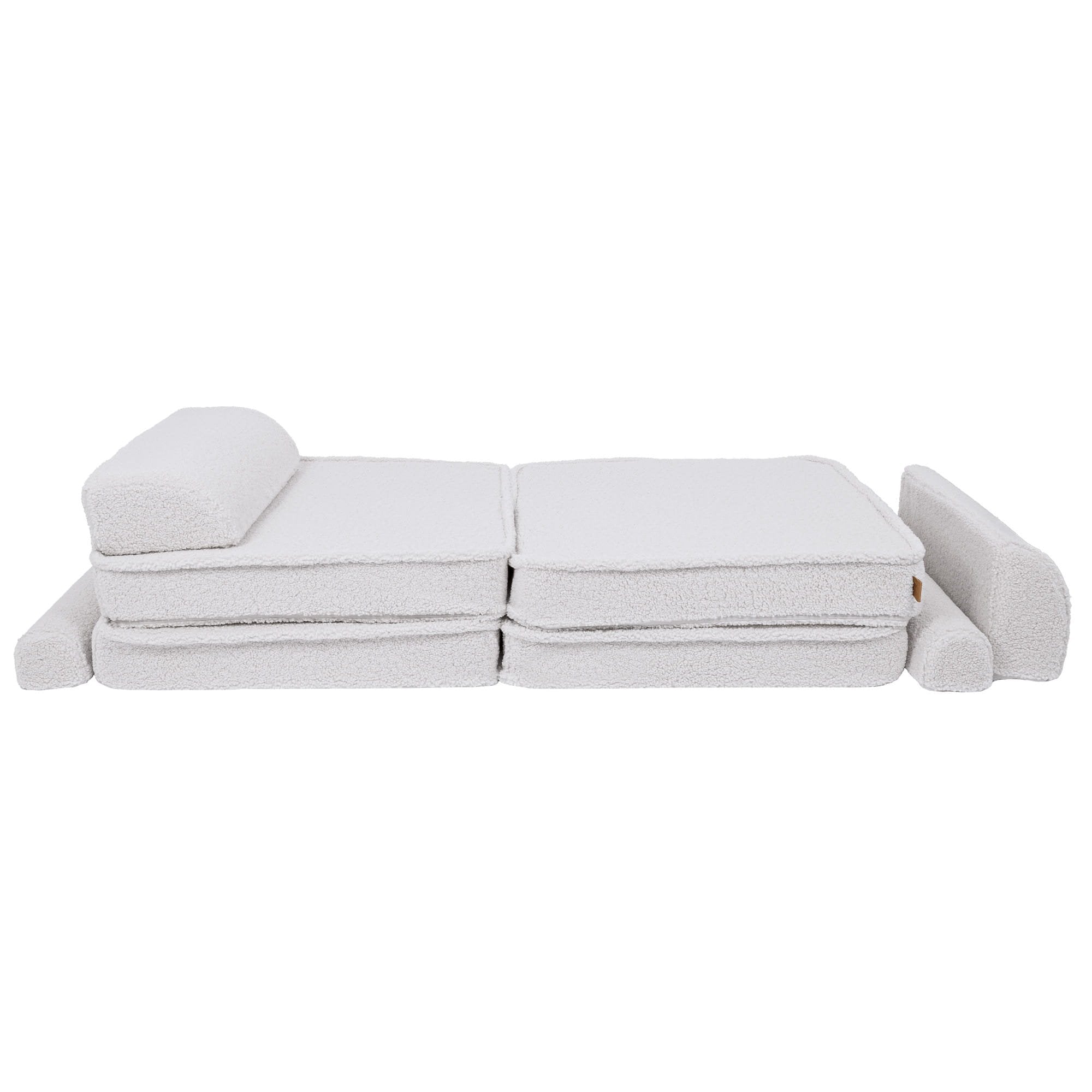 2. Large modular children's sofa in bearly white shown in a flat position with cushions rearranged