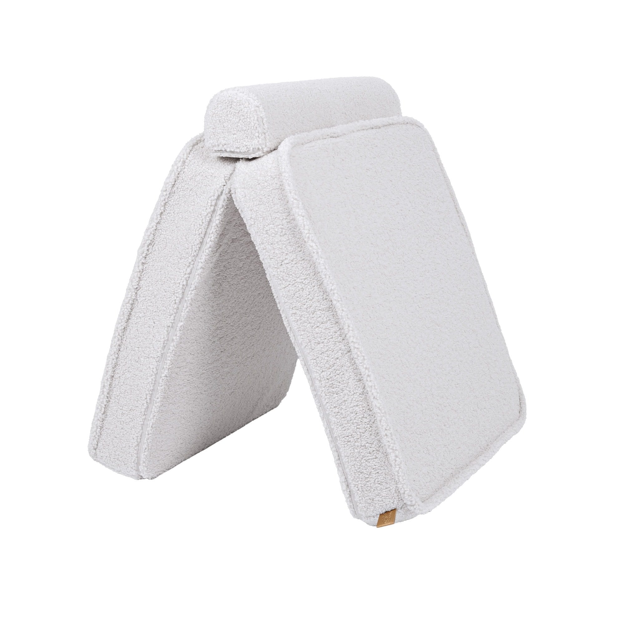 3. Close-up of two white sofa cushions arranged in a tent-like structure on a white background