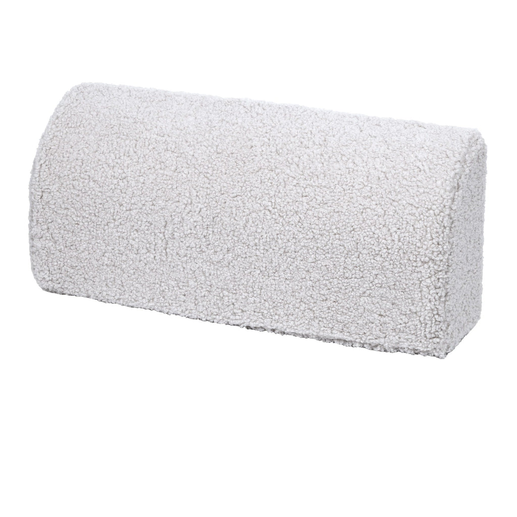 3. Close-up of a cylindrical cushion in bearly white on a white background