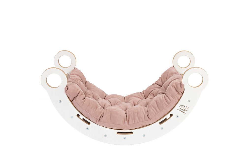 2. White wooden dream rocker with pink cushion, highlighting Scandinavian design and comfort