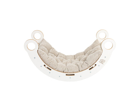 2. White wooden dream rocker with beige cushion, showcasing elegant and comfortable design