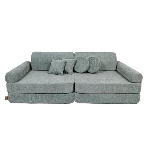 2. Large modular children's sofa in fresh mint boucle fabric with two square and one round cushion, shown in a studio setting