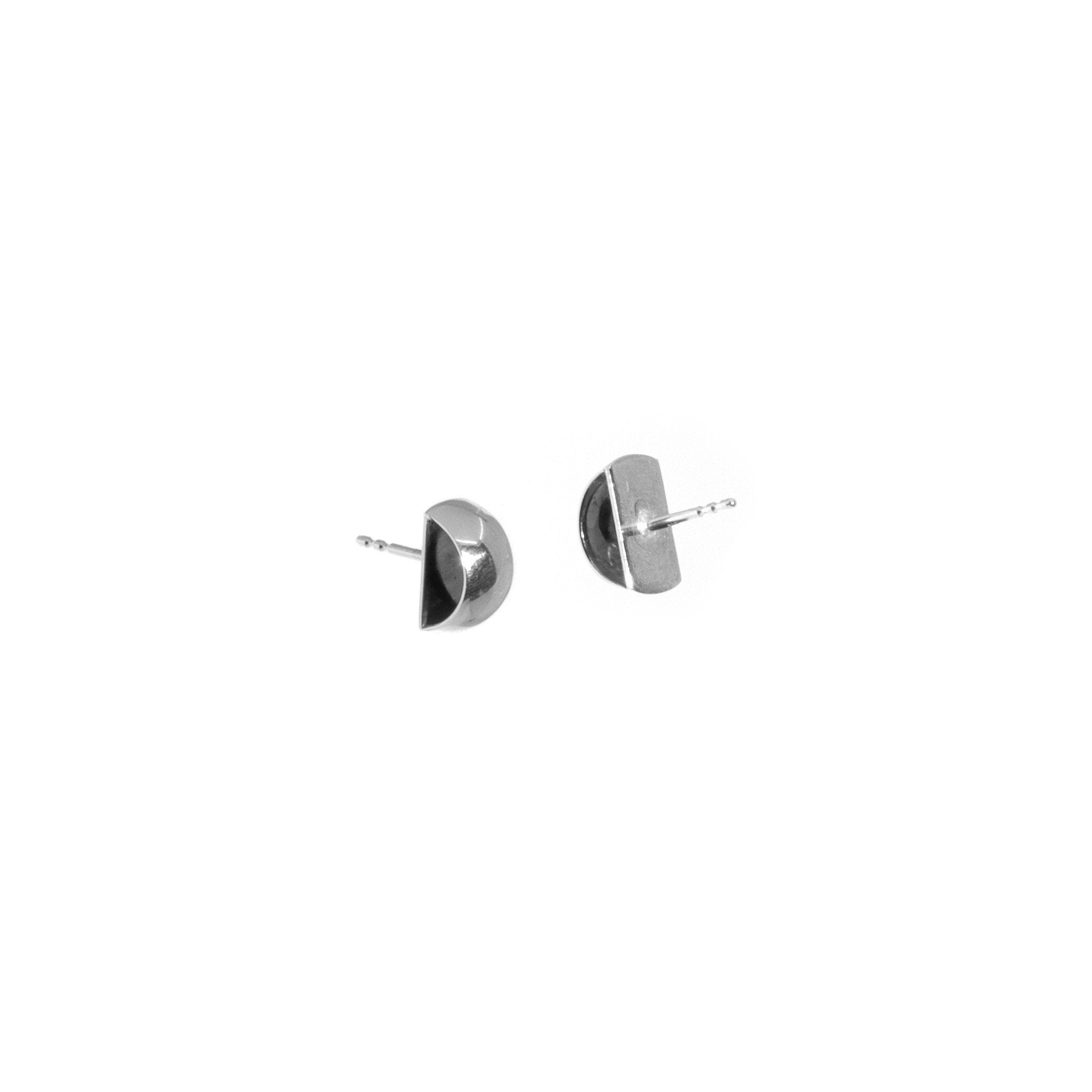 2. Studio shot of Maarja Palu HOLLOW Large Earrings in silver 925 with minimalist half-circle design