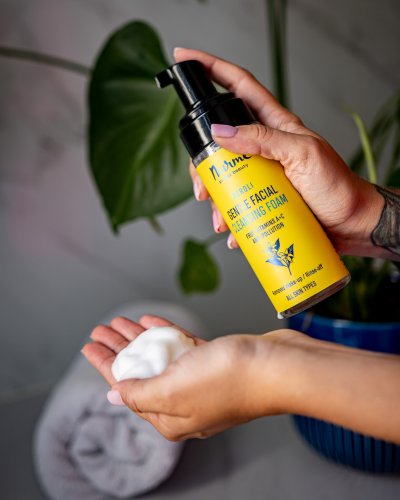 1. Woman applying Nurme Gentle Neroli Cleansing Foam to face, showcasing foamy texture and skincare routine