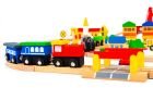 6. Close-up of train engine and wagons on wooden track with colorful buildings
