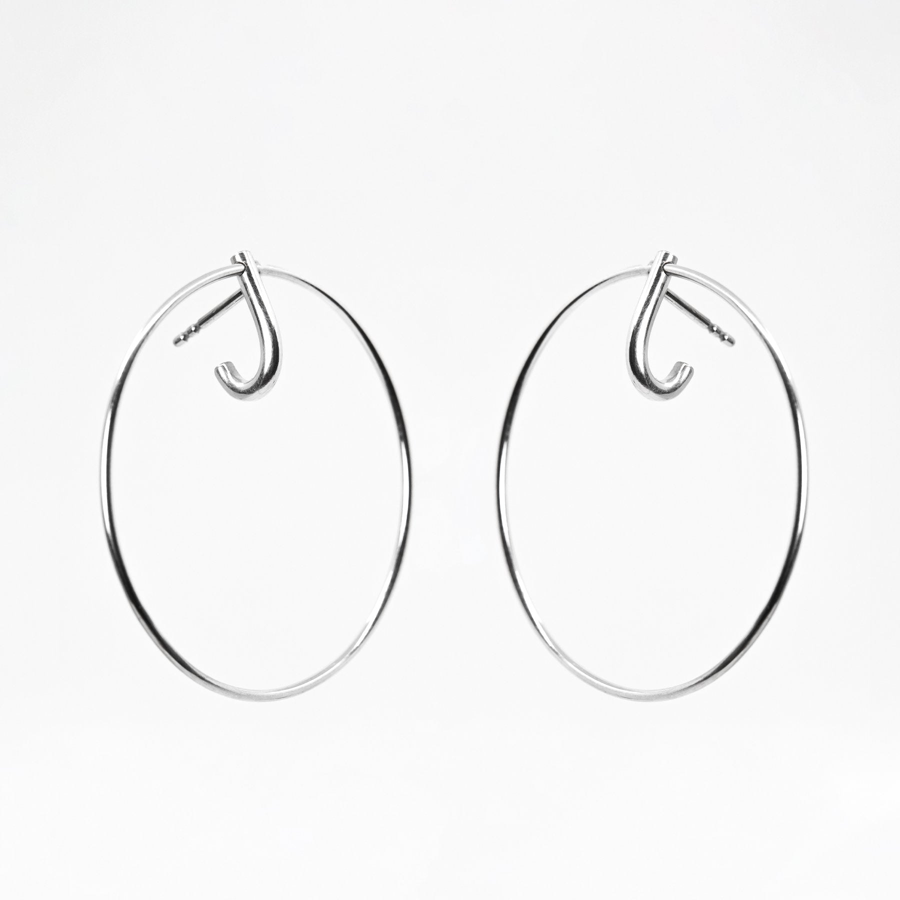 3. Studio image of Maarja Palu LAYERS x1 large silver earrings on white background