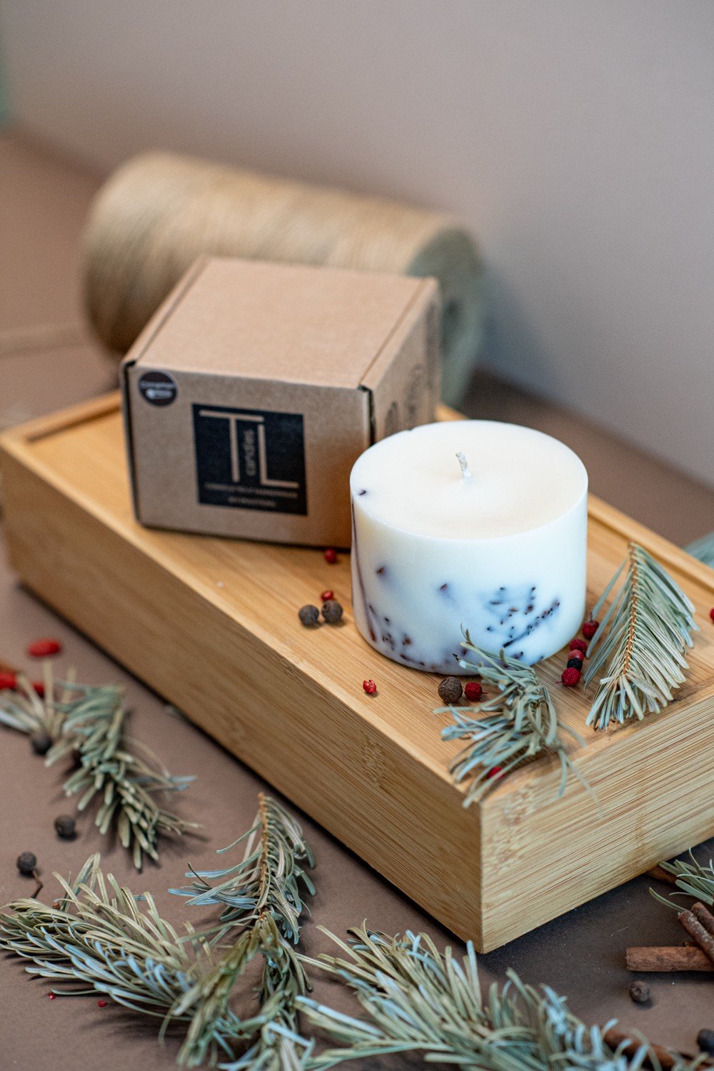 5. TL Candles box and white soy wax candle with lavender decoration, styled with natural elements