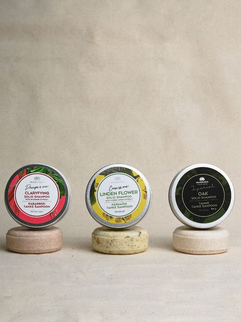 2. Trio of Magrada Organic Cosmetics solid shampoos, including Clarifying with rhubarb, Linden Flower, and Oak, displayed on stands
