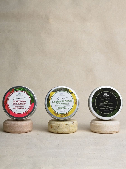 2. Trio of Magrada Organic Cosmetics solid shampoos, including Clarifying with rhubarb, Linden Flower, and Oak, displayed on stands