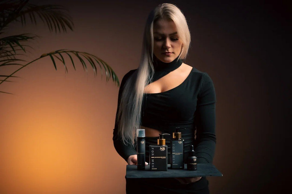 1. Woman holding a tray with North Beauty men's skincare products, including moisturising hand cream with aloe vera, in a lifestyle setting