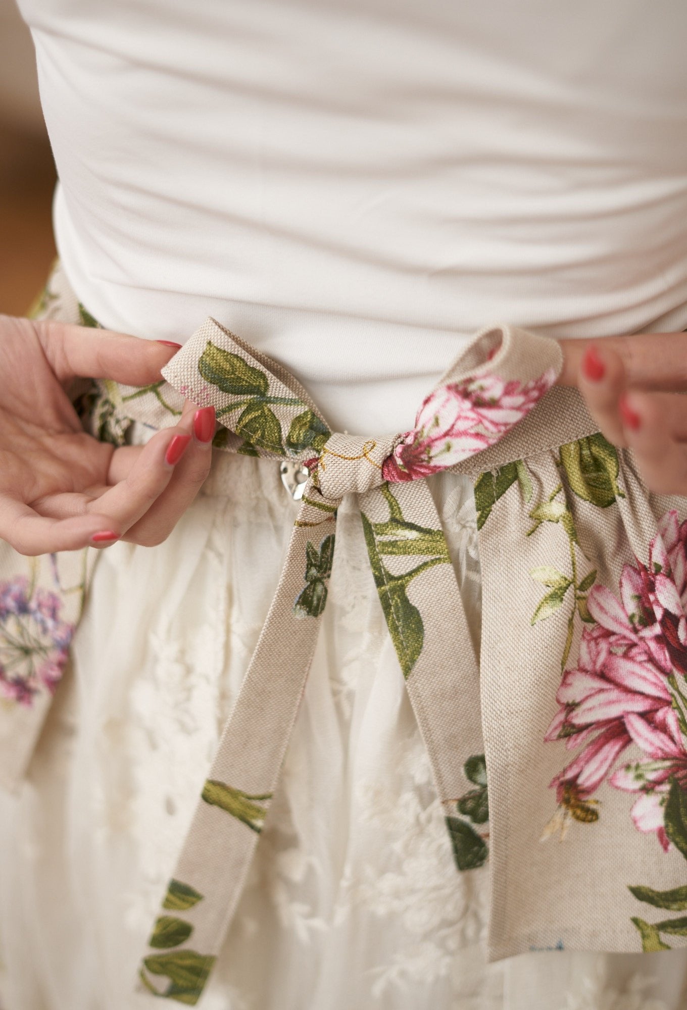 3. Close-up of floral apron tie with bow detail from Hortensias Home