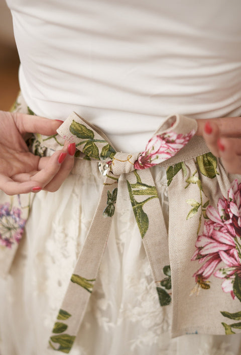 3. Close-up of floral apron tie with bow detail from Hortensias Home