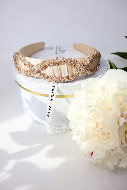 1. Eva Oherjus Mulberry Silk Headband Ada Thin with Swarovski crystals, displayed on luxury hat box with flowers
