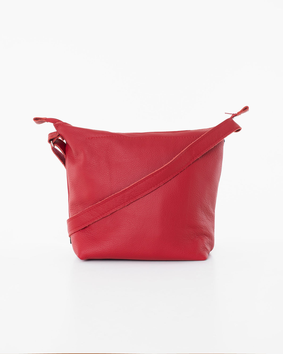 2. Back view of Trendbag Suvi XS red shoulder bag highlighting versatile strap design, studio shot