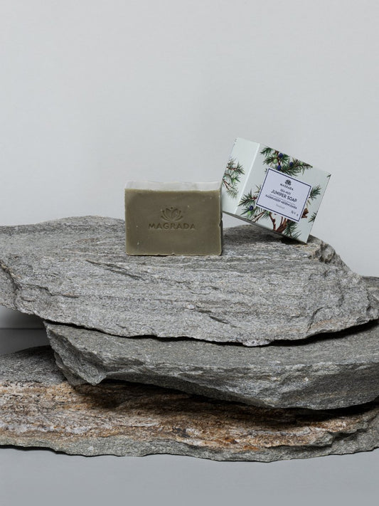 1. Magrada Organic Cosmetics Juniper and Sea Mud Soap displayed on natural stone, highlighting packaging and soap bar