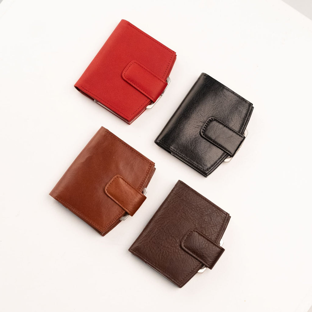 1. Flat lay of Papillon women's leather wallets in red, black, cognac, and dark brown, showcasing elegant design
