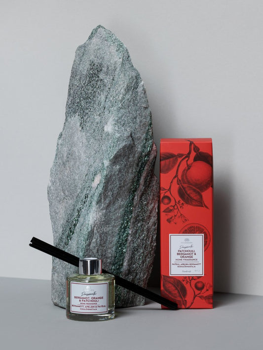 1. Magrada Organic Cosmetics 'Passionate' home fragrance with bergamot, orange, and patchouli, 100 ml, shown with natural reed sticks and aesthetic packaging against a stone backdrop