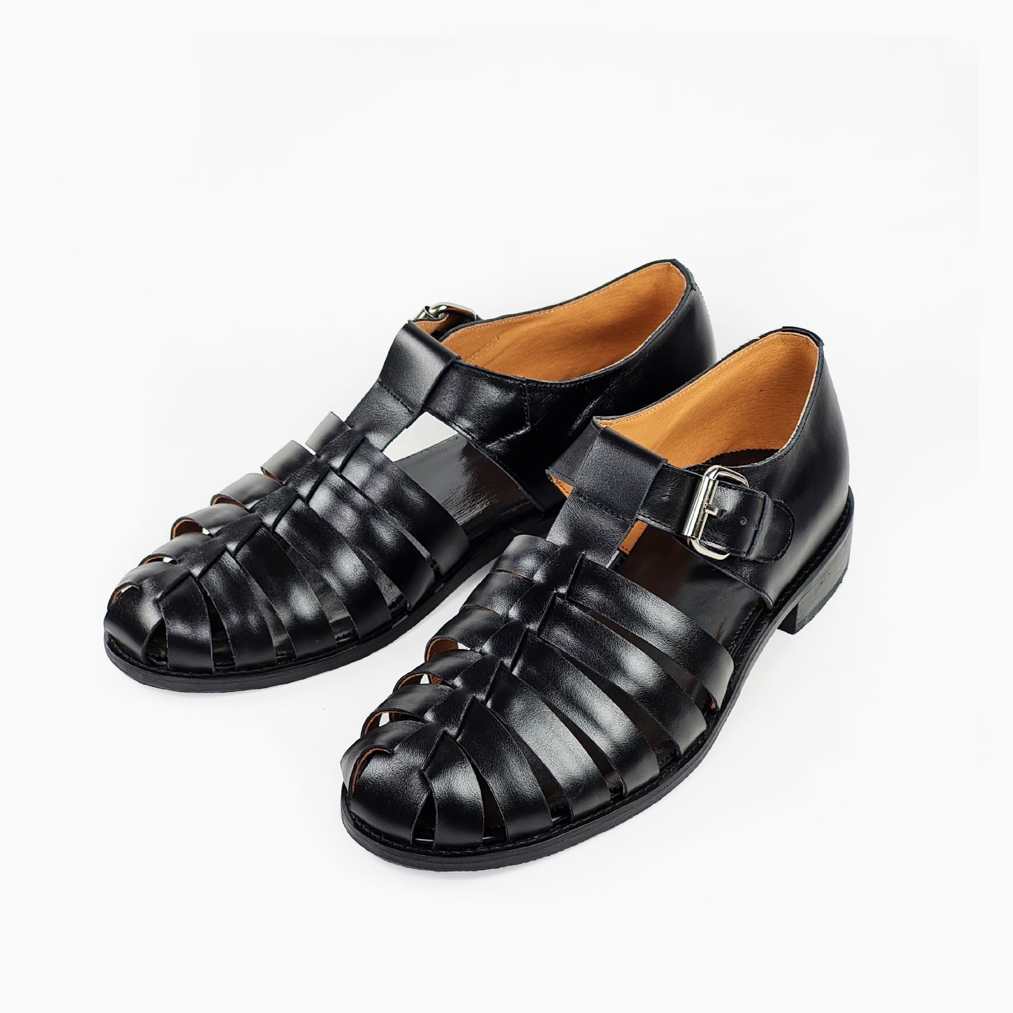 1. Men's black handmade leather fisherman sandals by Daz Studio, featuring adjustable strap and silver-tone buckle, shown in studio setting