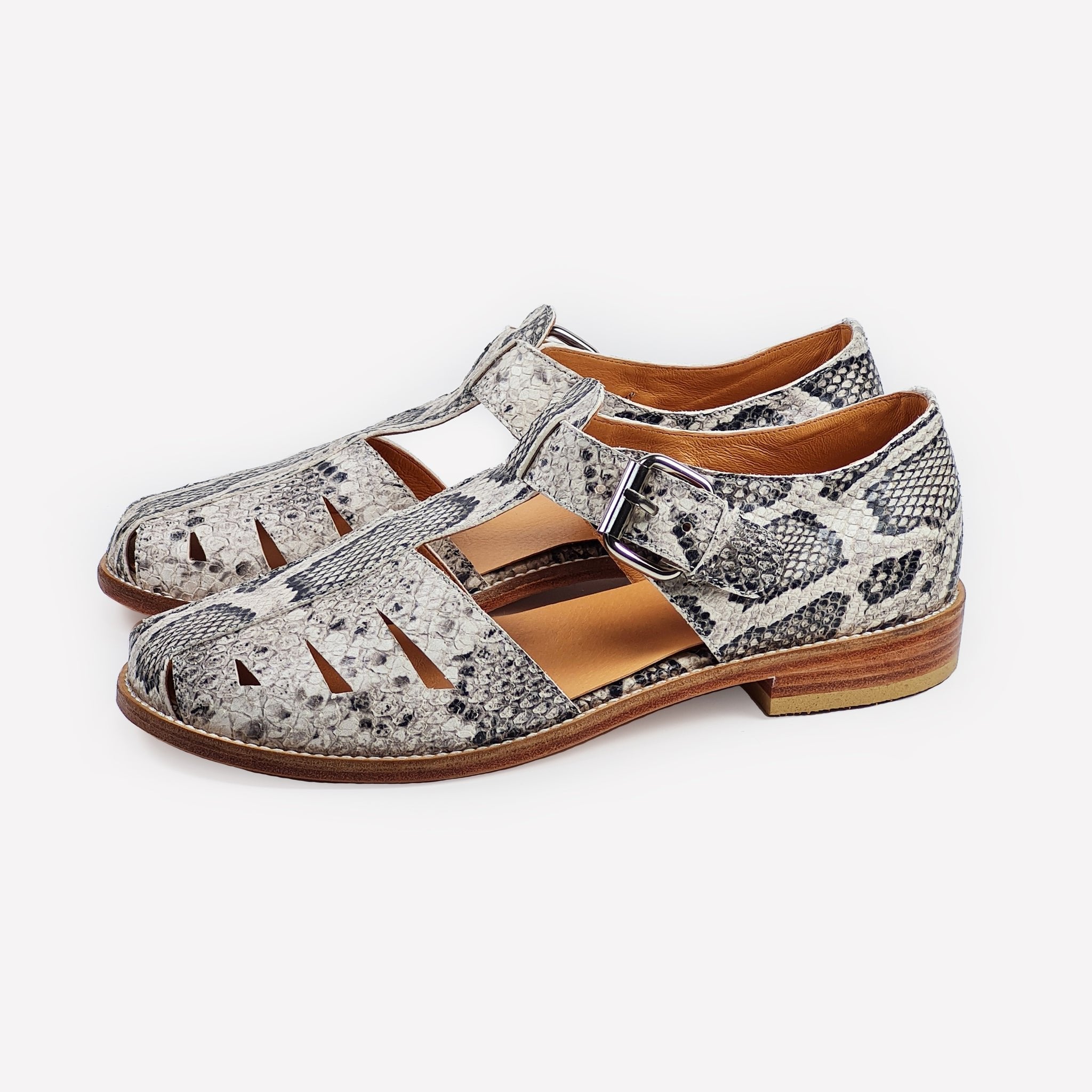 2. Side view of Daz Studio handmade snake print sandals with leather sole and adjustable buckle