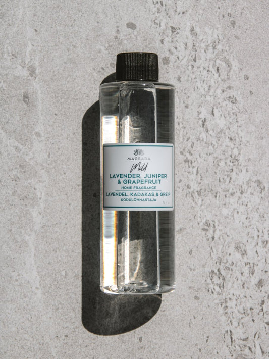 2. Close-up of Magrada Organic Cosmetics Mild home fragrance refill bottle, highlighting lavender, juniper, and grapefruit scent