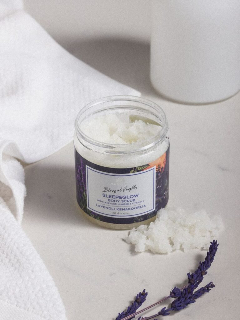 9. Open jar of Magrada Sleep&Glow body scrub on marble surface with lavender sprigs