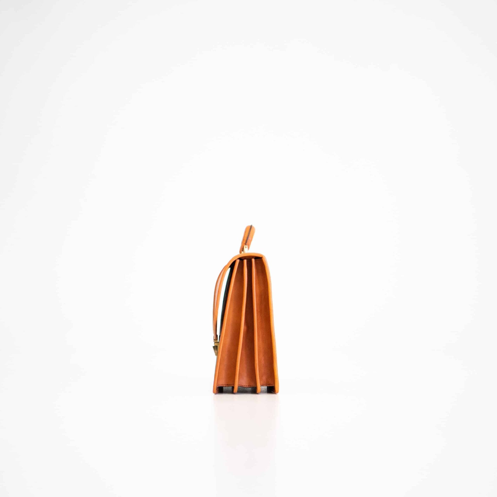 3. Side view of Papillon Briefcase No. 20 in cognac leather, showcasing three gussets