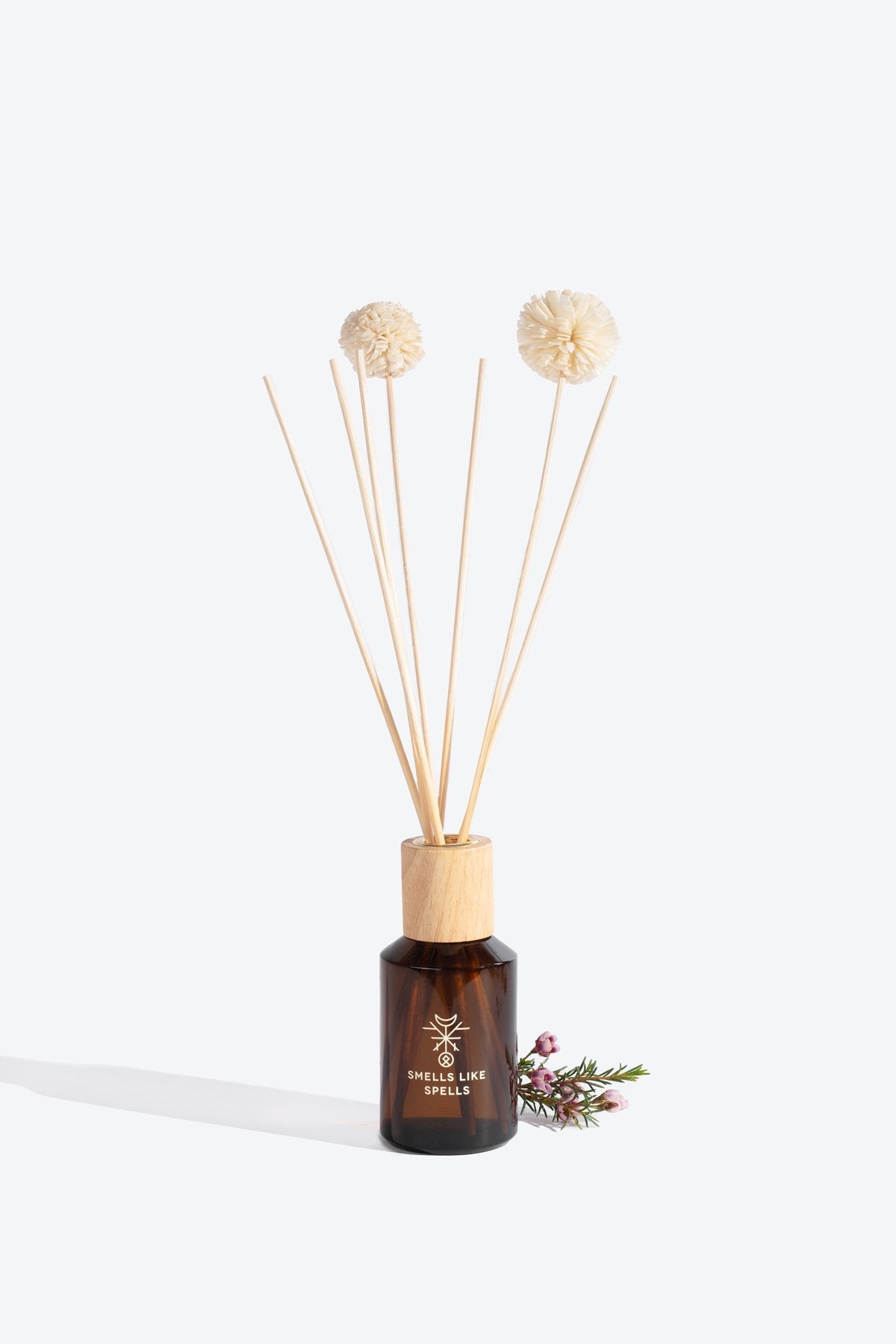 1. Smells Like Spells Home Perfume ODIN with diffuser sticks in amber glass bottle, studio setting
