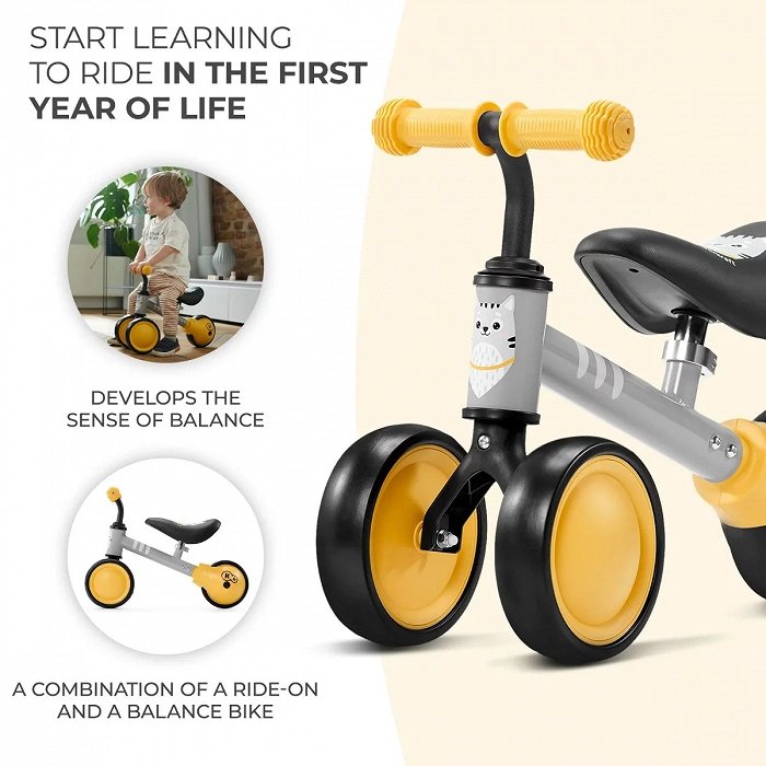 6. Yellow Kinderkraft CUTIE balance bike with kitten print and non-slip handles promoting balance development