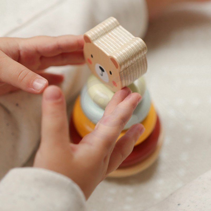 12. Child placing bear head on pyramid from Woopie Let's Go Green 3in1 toy set