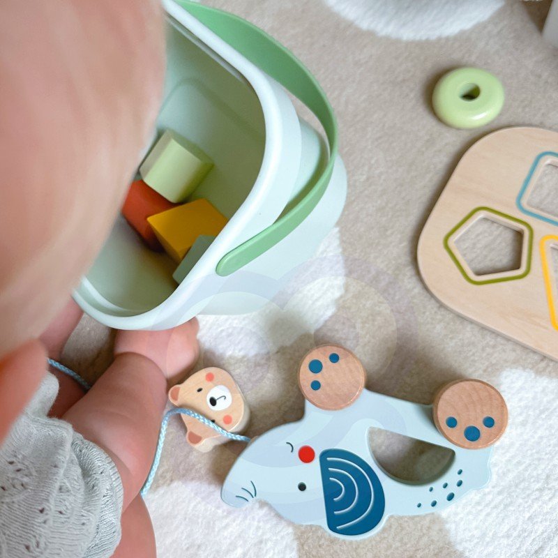 9. Baby exploring Woopie Let's Go Green 3in1 toy set with elephant and shape sorting box