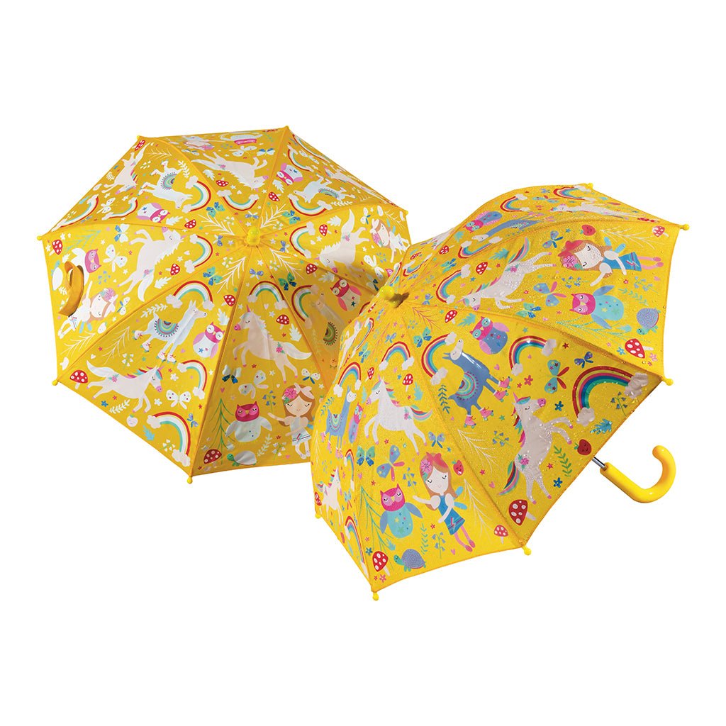 1. Children's yellow umbrella with colorful rainbow and fairy motifs, featuring a curved handle and Velcro fastener, designed to change colors in the rain, shown open on a white background.