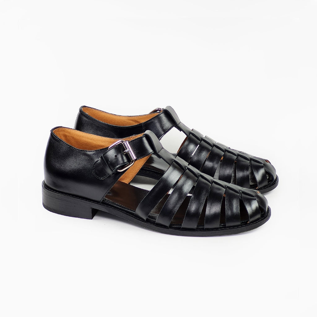 4. Side view of men's black leather fisherman sandals with stacked heel