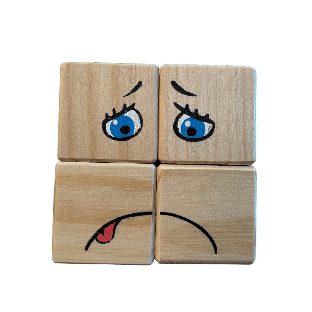 4. Four pinewood blocks depicting a worried face with blue eyes and a tongue out, from ROOSI Traditional Toys' Special Expressions Blocks for Kids