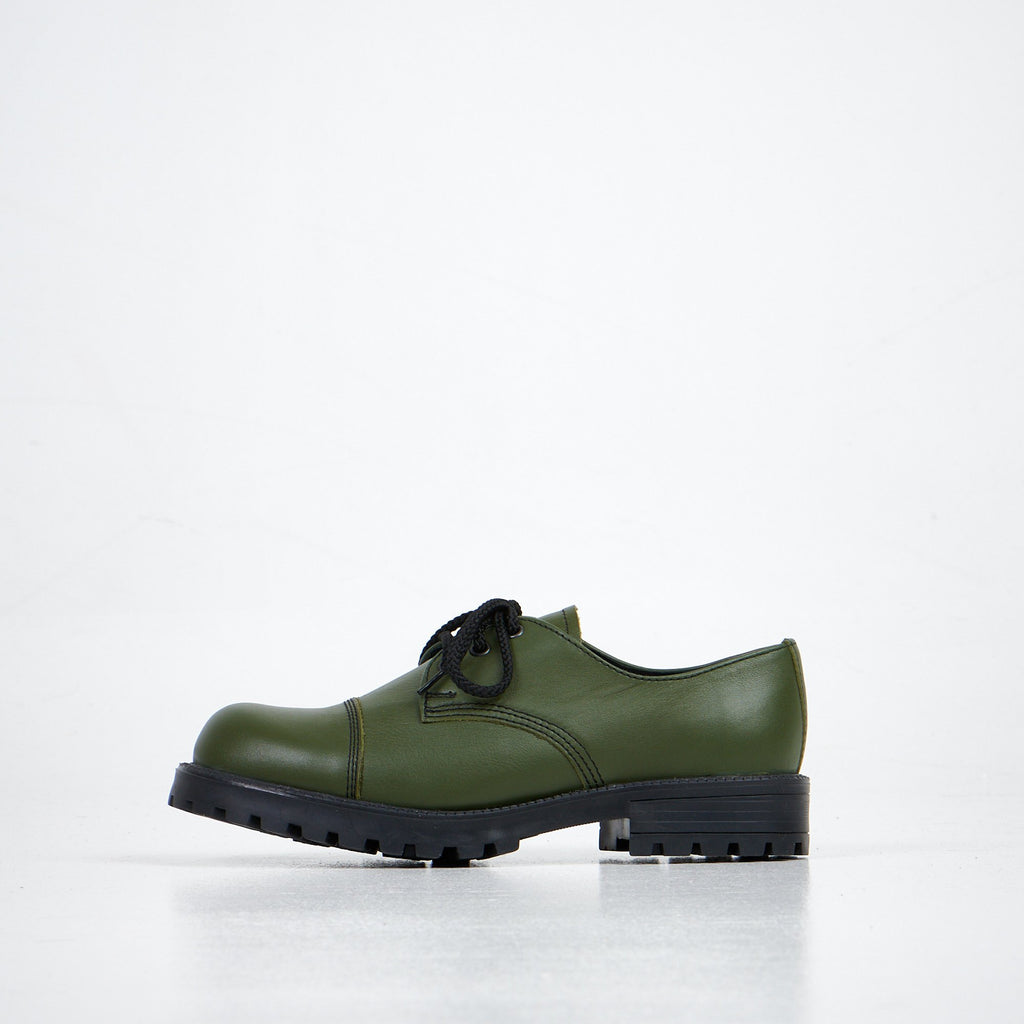 4. Profile view of unisex green Samelin Green Widgets shoes, featuring leather and textile lining for comfort